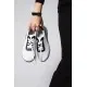 Білі жіночі текстильні кросівки із чорними вставками